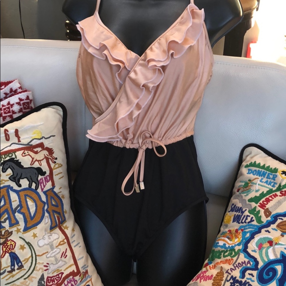 One piece swimsuit with adjustable waist and sraps